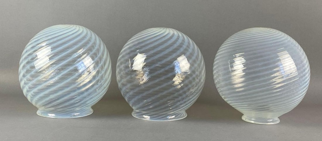 Group of 3 Antique Opalescent Spiral Globe Glass Lamp Shades: Largest measures 8 inches H x 7 inches W with a 5 inches fitter