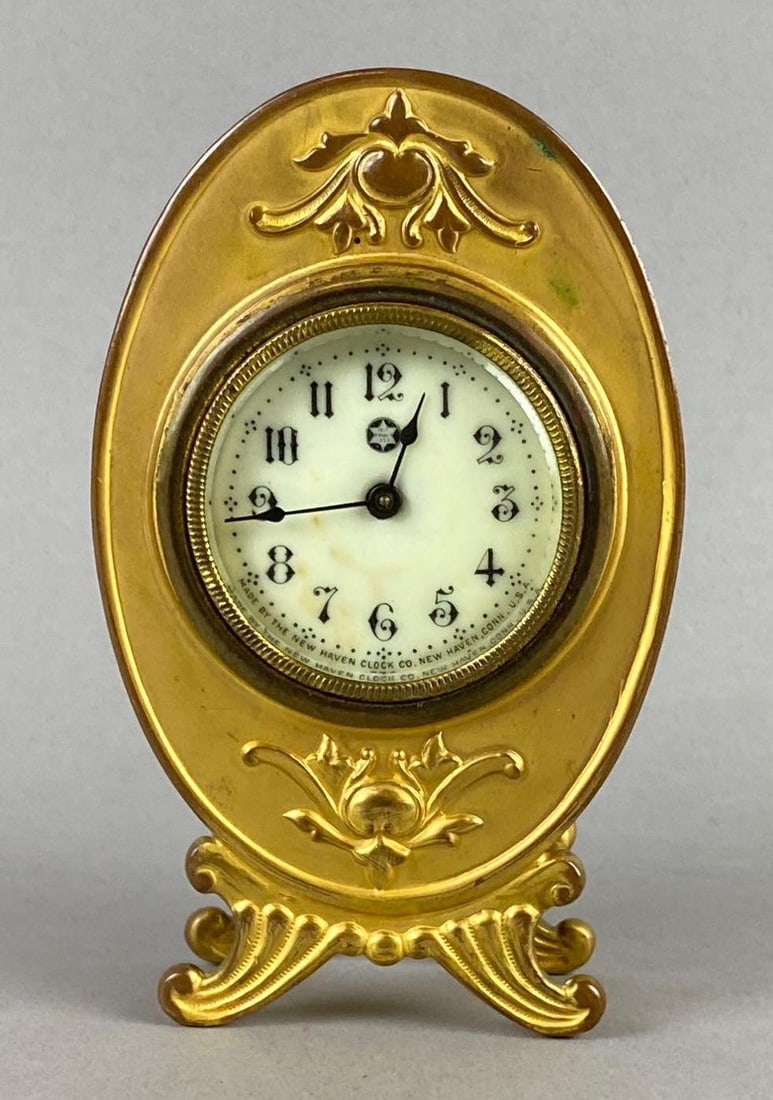 Antique 1910 Jennings Bros. Art Nouveau Brass Desk Clock: Has small crack on leg. Tested and working. Measures 5 tall.
