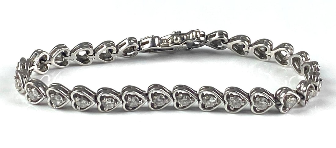Sterling Silver CZ Openwork Heart Link Tennis Bracelet: Clasp does not lock, Some CZ gems missing, Measures 7 in length