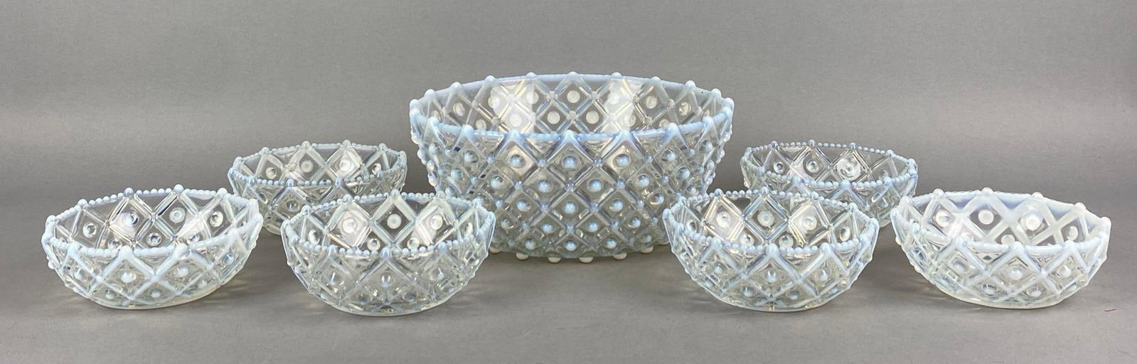 Set of 7 Antique Aetna Opalescent Hobnail Lattice Glass Bowls: Largest measures 3 1/2 H x 8 1/2 W