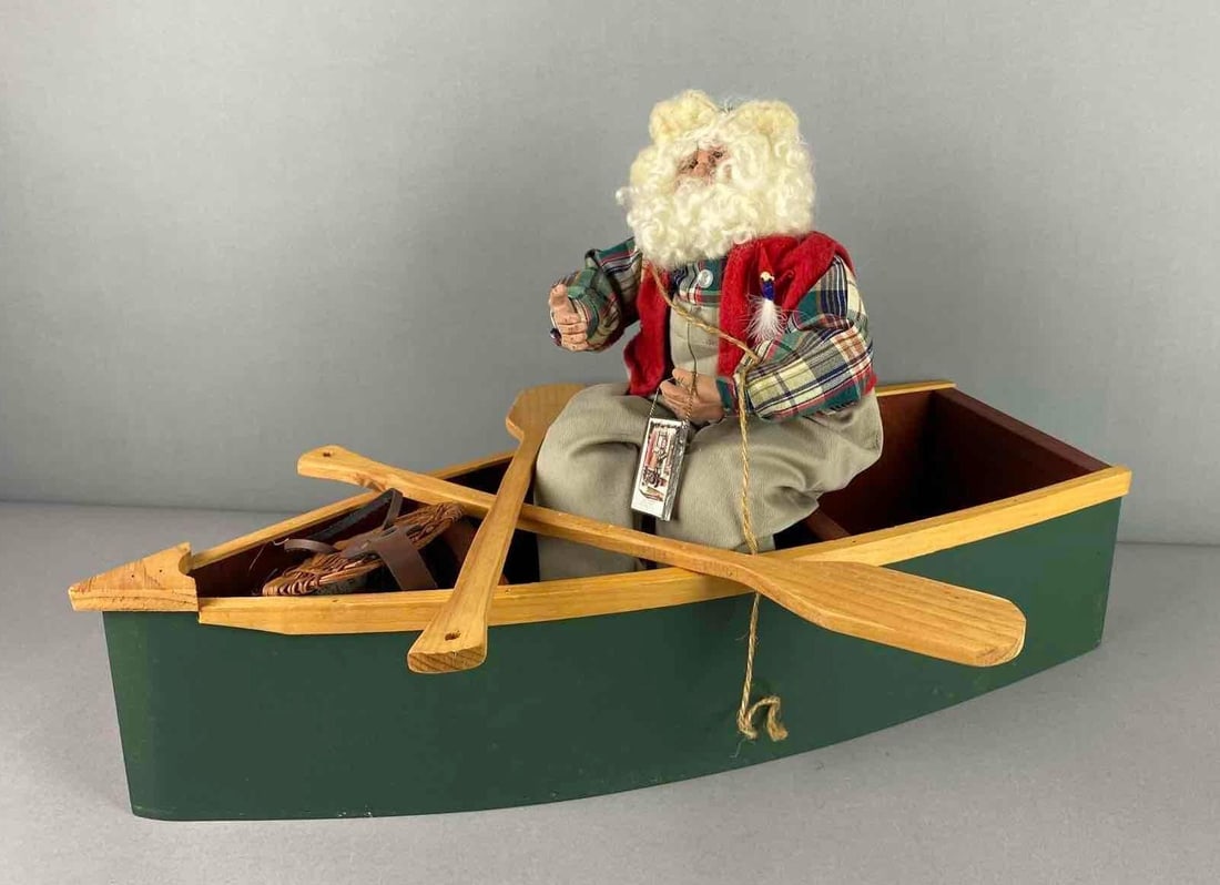 Vintage Christmas Santa Gone Fishing Themed Display: Includes Oars, Fishing Basket, and more. Boat measures H 5 x W 7 x L 23 inches.