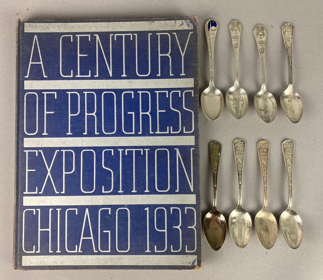 1933 A Century of Progress Exposition Chicago Photo Book and More: Includes 8 Silver plated 1933 Chicago World Fair Souvenir Spoons. Book has rips and tears on outside cover. Measures L 14 x W 10 inches.