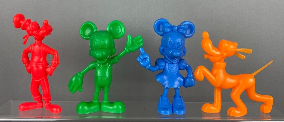Group of 4 Vintage 1960?s Louis Marx Disney Figures: Includes Mickey, Goofy, and more. Largest measures 5 tall. Stand not included.