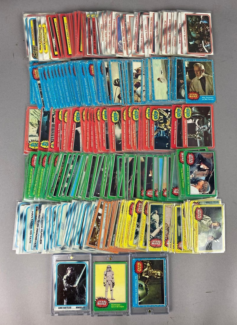 Group 100+ Vintage 1977 Topps Star Wars Trading Cards: Includes Luke Skywalker, Stormtrooper, and more.