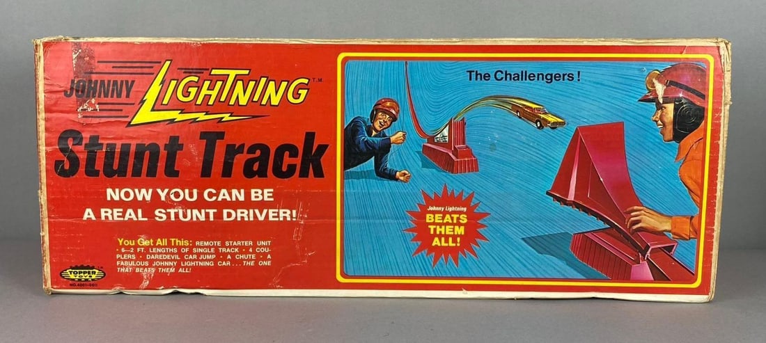 Vintage 1970?s Topper Toys Johnny Lightning Stunt Track: Missing car. Package has rips and tears throughout. Measures H 8 x aw 9 1/2 x L 25 inches.