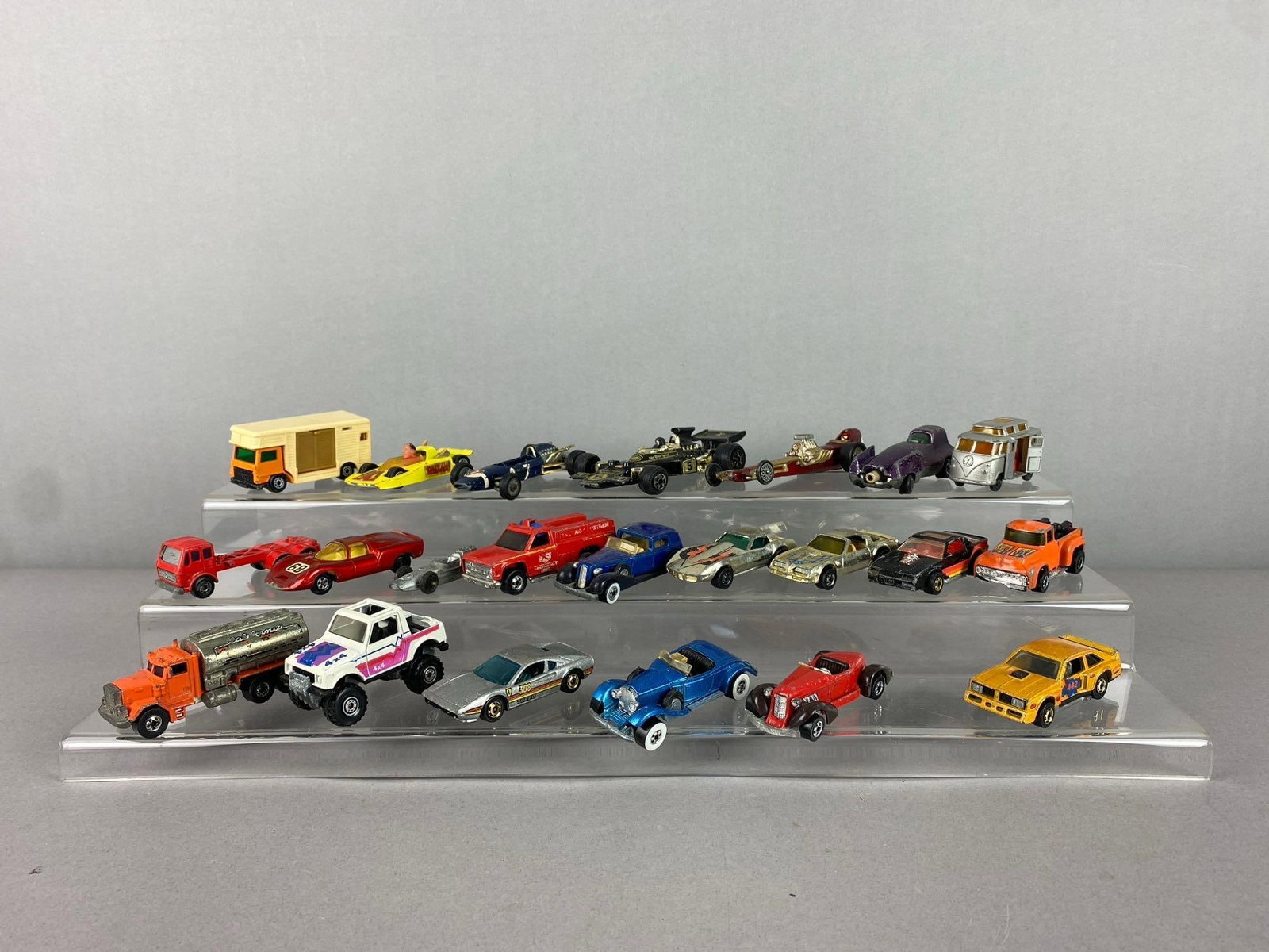 Group of Assorted Vintage 1970?s Mattel Hot Wheels 1/64 Scale Die-Cast Vehicles and More: Includes Corgis Toys vehicles too. Largest measures 4 in length. Stand not included.