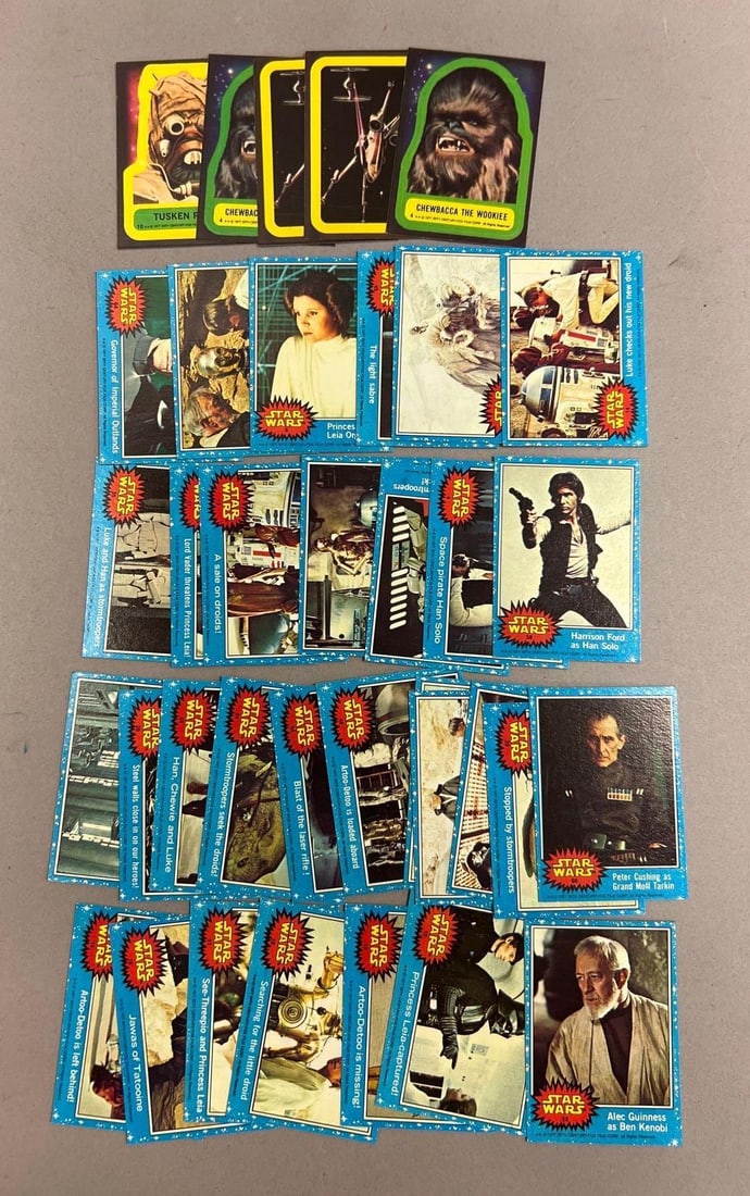 Vintage 1977 Star Wars Topps Trading Card Lot w/ Blue and Black Series: Vintage 1977 Star Wars Topps trading card lot featuring Blue and Black Series cards with characters, scenes, and spacecraft from the original film. Includes Chewbacca, Han Solo, Ben Kenobi, Grand Moff