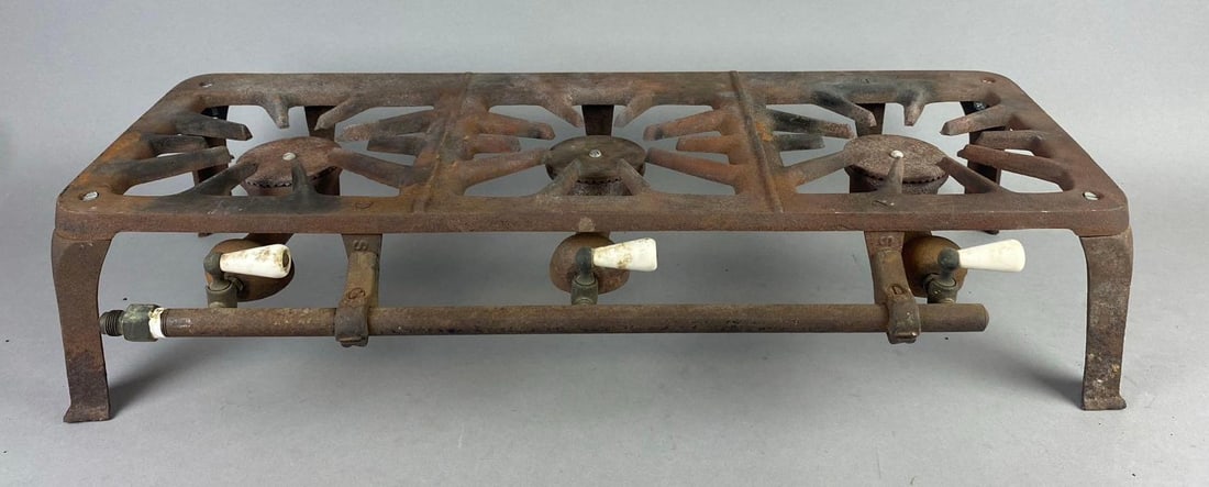Antique 1920?s 3 Burner Cast Iron Gas Stove: Untested. Rust throughout. Measures H 5 1/2 x W 10 x L 27 inches. Can be taken apart.