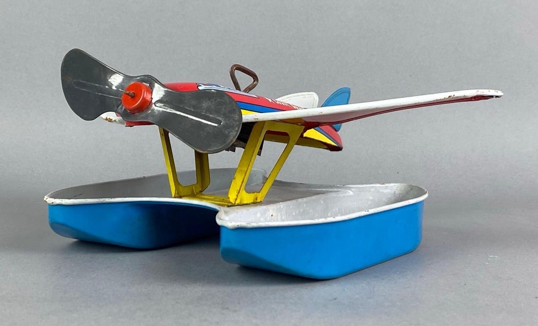 Vintage Ohio Art Co. NX4010K Wind-Up Tin Litho Coast Guard Plane: In non working condition, some scratches throughout, measures 3 H x 10 W x 8 D