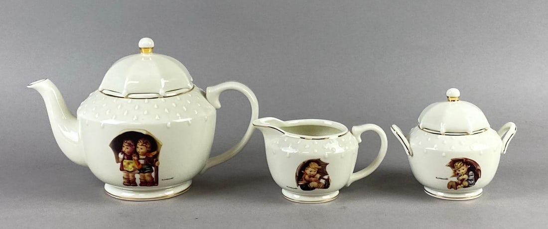 The Danbury Mint M.J. Hummel Porcelain Tea Set: Includes Pitcher, Creamer, and more. Largest measures 4 1/2 tall.