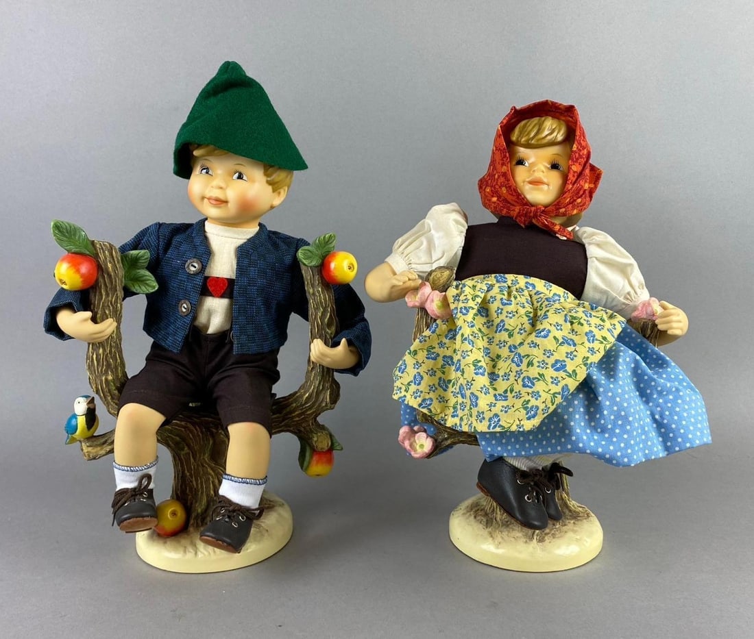 Group of 2 Vintage M.J. Hummel Porcelain Boy and Girl Tree Sculpture: Measure 13 tall.
