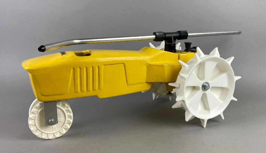 Nelson Rain Train Traveling Lawn Cast Iron Sprinkler: NOS. Untested measures 19 in length.