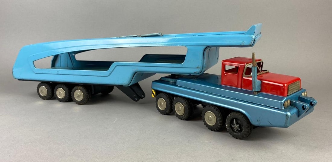 Vintage 1960?s Japan Sear Exclusive Tin Litho Friction Hauler Vehicle: works, front wheel missing cover and trailer Dolly tires are missing. Measures 23 in length. Mfg by SSS international in Japan.