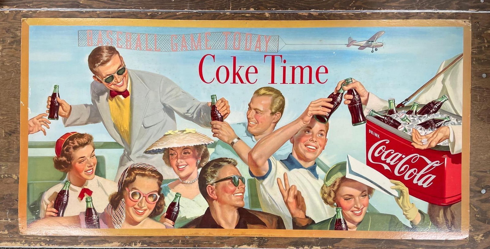 1954 Coca-Cola Baseball Game Today Cardboard Advertising Sign: Snyder and black litho, some holes and water damage, measures 27 1/2 inches x 56 1/2 inches