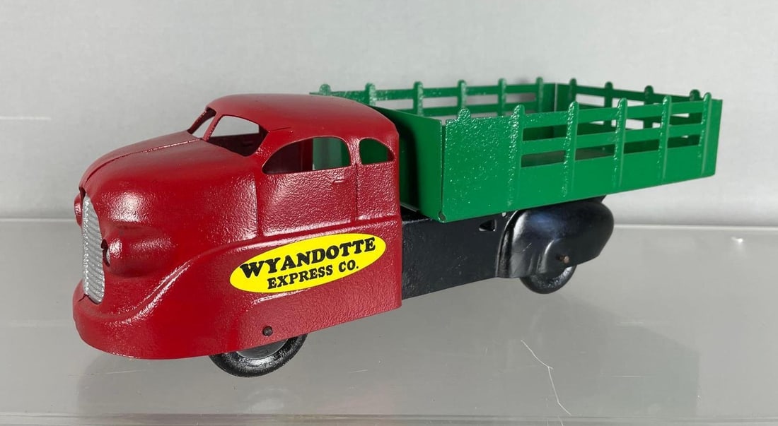 Refinished Vintage Wyandotte Express Pressed Steel Stake Truck: Repainted, measures 4 1/4 inches x 13 1/2 inches x 5 inches