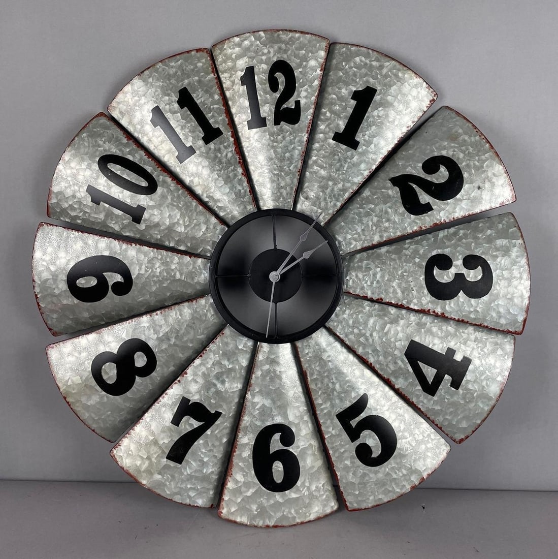 Metal Windmill Wall Clock: Working condition, measures 28 3/4 inches