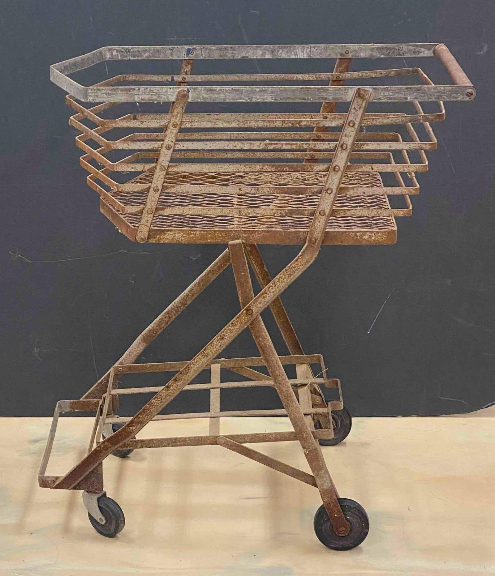 1940s Steel Shopping Cart: NO IN HOUSE SHIPPING AVAILABLE, THIRD PARTY SHIPPING RECOMMENDED, rust throughout, front casters jammed, measures 34 inches H x 16 inches W x 28 1/2 inches D