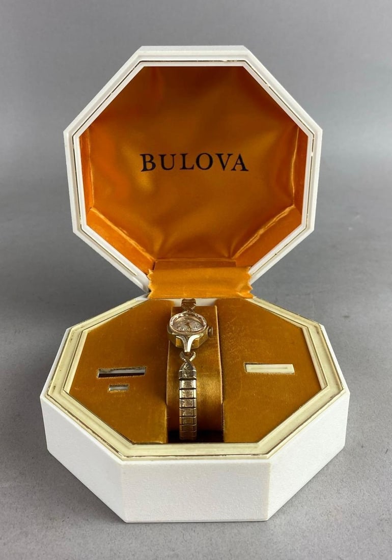 Antique 1940s Bulova 10k Gold Ladies Cocktail Watch: Non working. Comes with original packaging. Packaging measures H 2 x W 5 x L 5 inches.