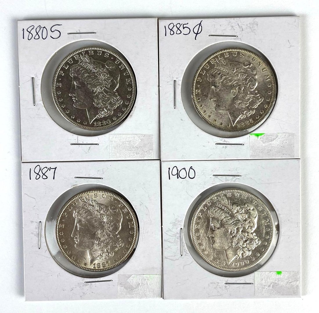 Group of 4 US $1 Morgan Silver Dollars: Includes 1880-S, 1885-O, 1887, and 1900.