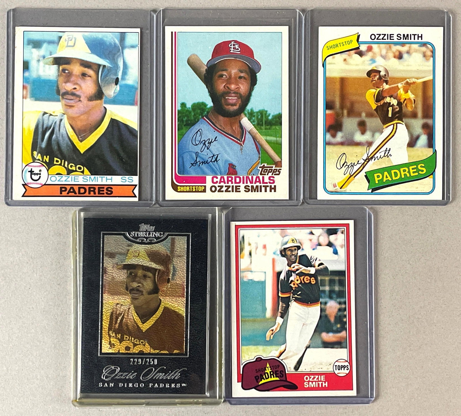 5 - Ozzie Smith Topps Cards with Rookie: 1979 Topps VG, 1980 and 81 Topps NM, 1982 Topps Traded NM - NMMT, 2006 Topps Sterling Rookie Commemorative 229/250