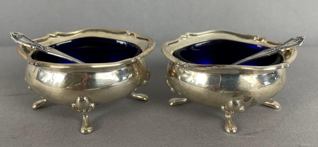 Group of 2 Vintage Sterling Silver and Cobalt Glass Footed Salt Cellars: Made in England, includes 2 sterling spoons, each measure 1 1/4 inches x 2 1/2 inches x 2 inches