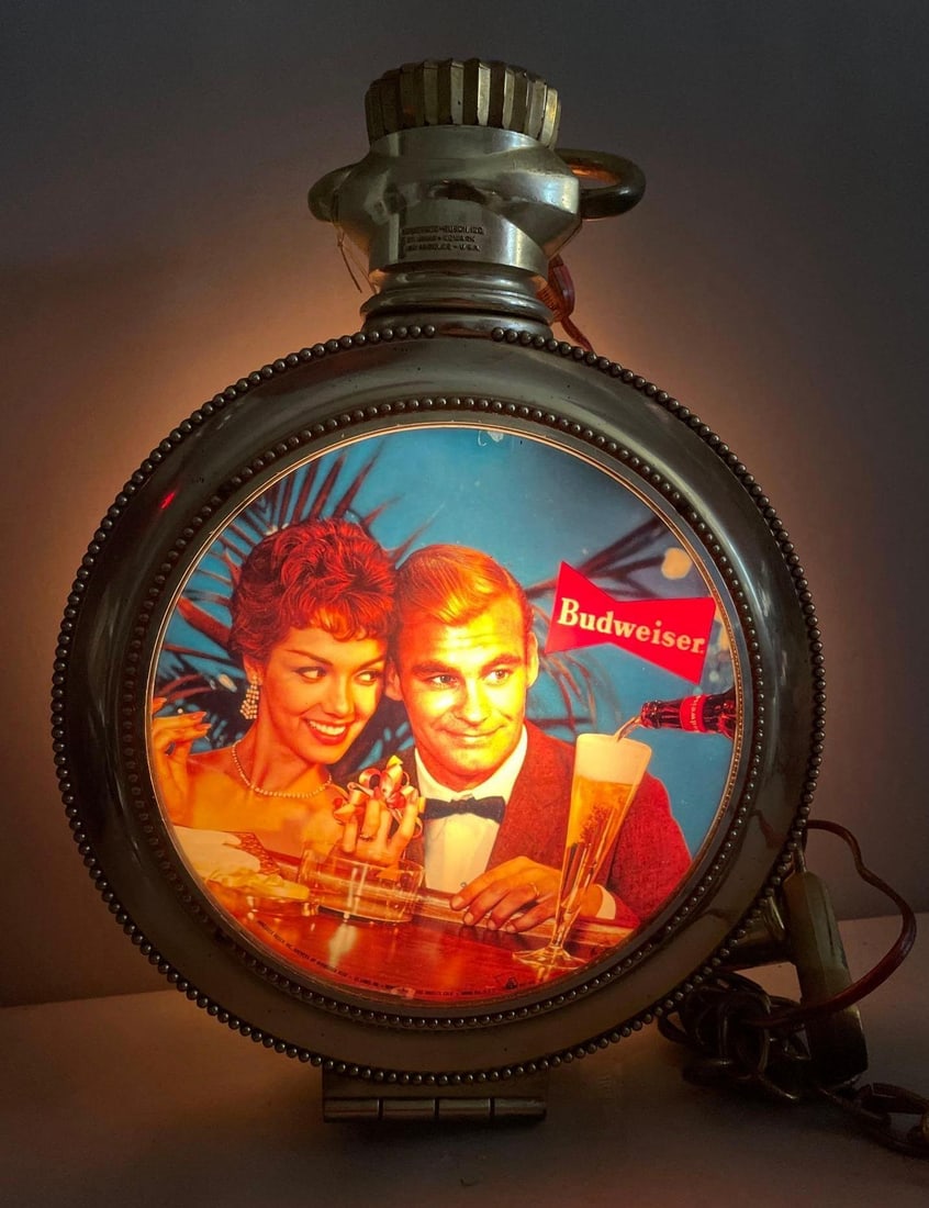 Vintage Budweiser Beer Light-Up Rotating Advertising Clock: Working condition light and clock, rotation did not work in test, measures 18 inches x 12 1/2 inches x 3 3/4 inches