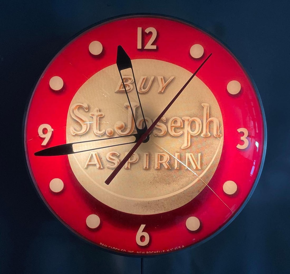 Vintage St. Joseph Aspirin Light-Up Advertising Clock: Working condition, bubble glass, inner glass cracked, measures 15 inches x 4 1/2 inches
