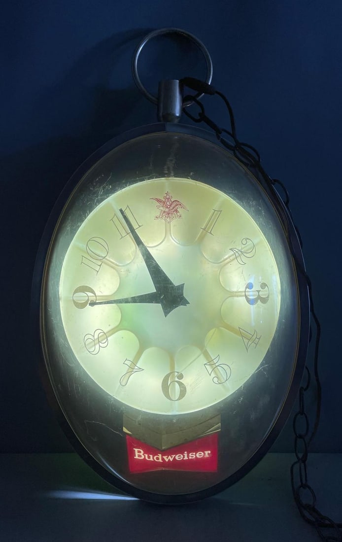 Vintage Budweiser Beer Rotating Light-Up Advertising Clock: Working light and clock, did not spin, lenticular reverse side, measures 23 inches x 13 inches x 6 1/2 inches