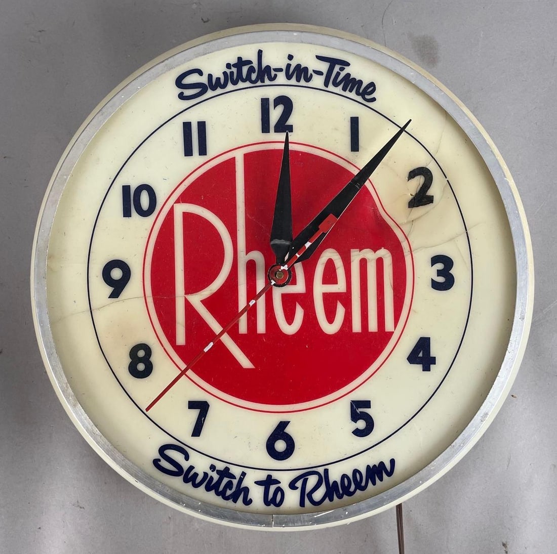Vintage Rheem Light-Up Advertising Clock: Needs rewired, heat damaged face, measures 16 1/2 inches x 5 inches