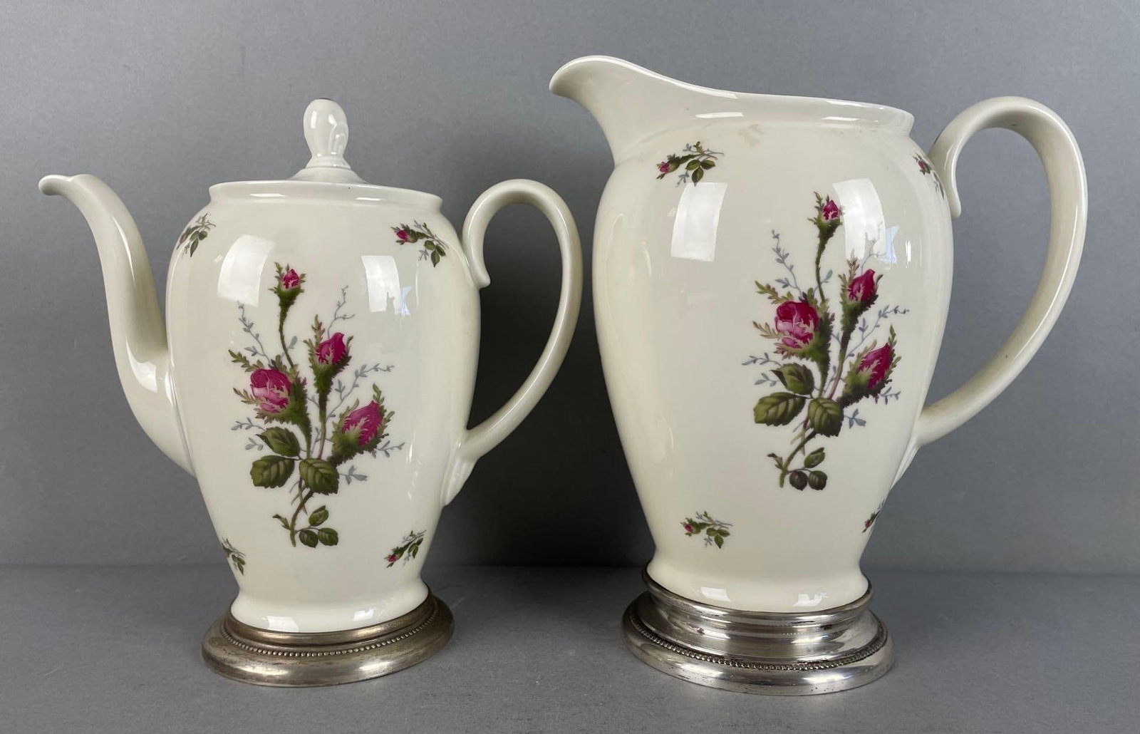 Group of Rosenthal Aida Floral Pitchers: Sterling silver bases, largest measures 8 1/2 x 7 1/2 x 5 inches