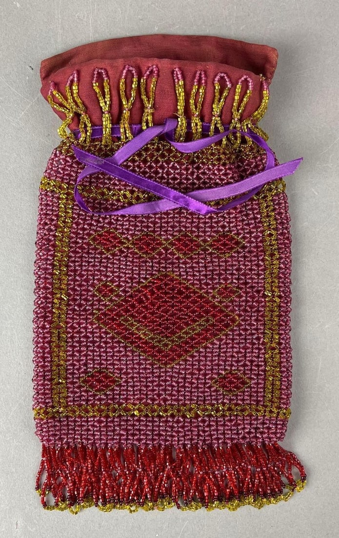 Antique Beaded Pouch Purse: May have been repaired. Measures H 9 _ W 5 1/2 x D 1 1/4 inches.