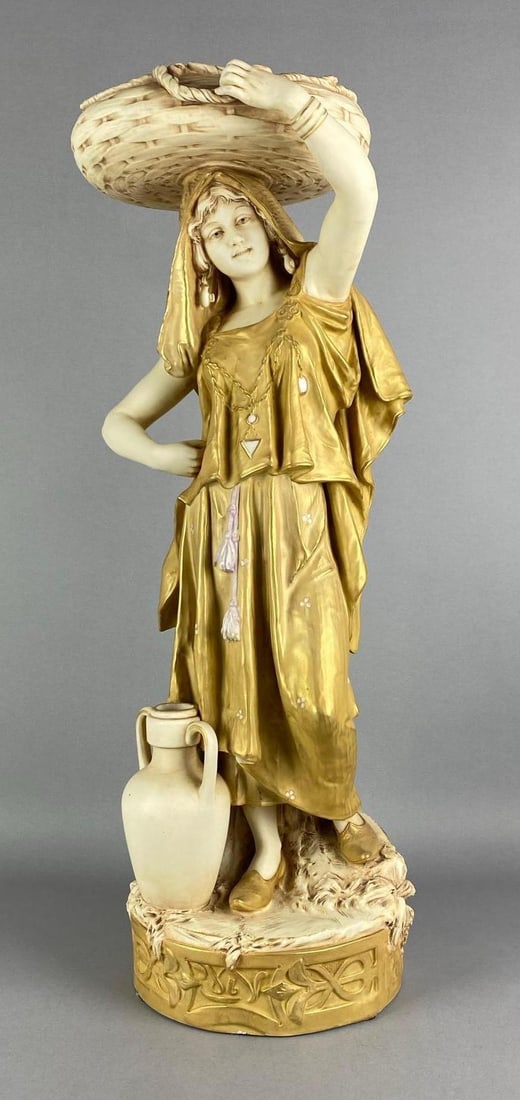 Royal Dux Art Nouveau Woman with Basket Porcelain Figurine: Marked on base, one small chip shown on garment of woman, some small areas with paint wear, measures 26 inches H x 8 1/2 inches W x 8 inches D
