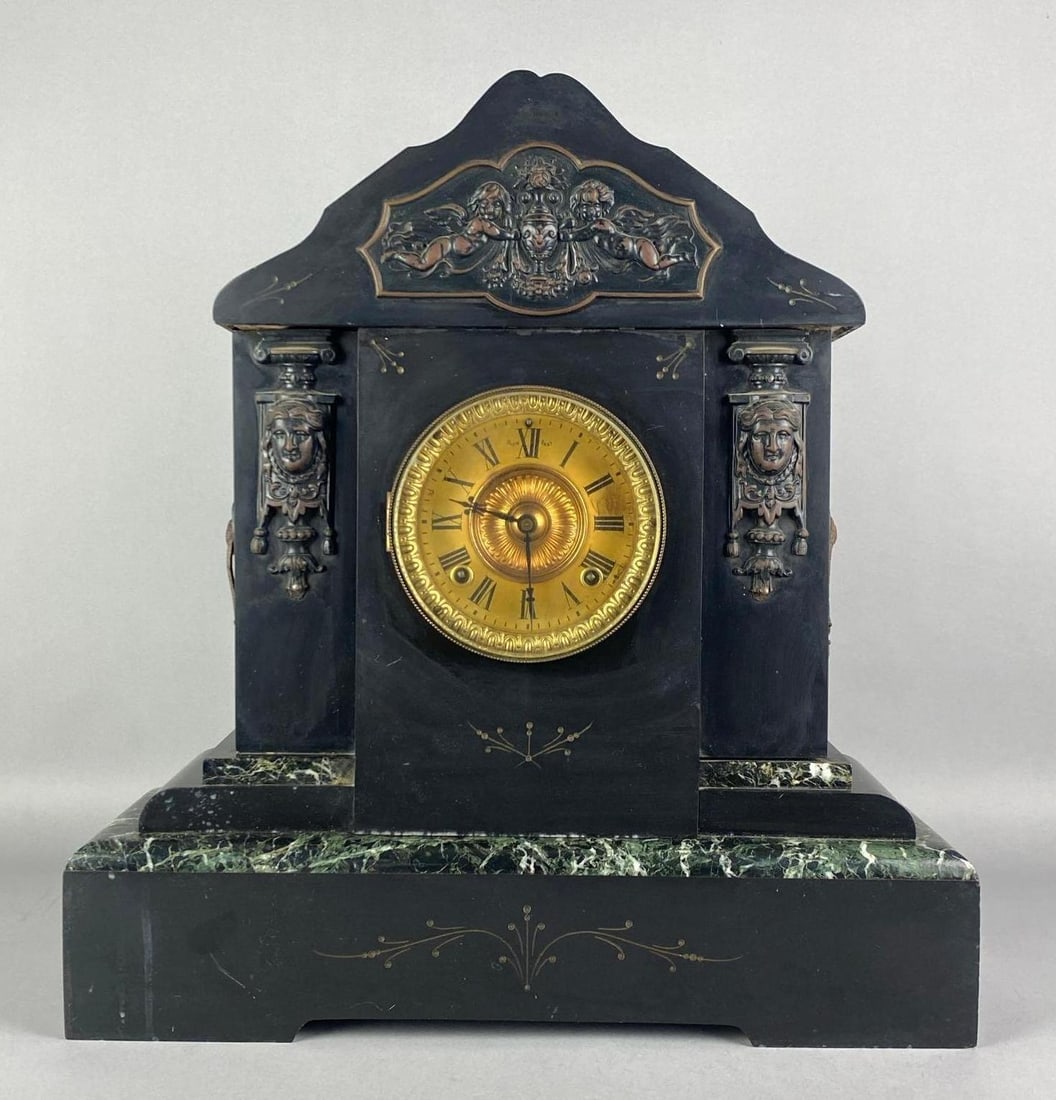 Antique Victorian Ansonia Clock Co. Marble Mantel Clock: No Inhouse Shipping, Third Party Shipper is Required. Untested, features inlayed brass decorations and figural cherub and women reliefs, missing original key, separations shown around mid section, mea