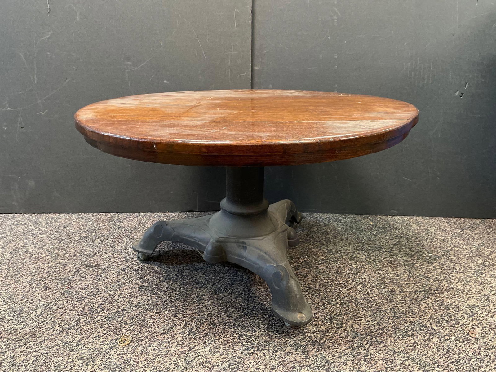 Vintage Quarter-Sawn Oak Coffee Table with Cast Iron Base: No in-house shipping available, 3rd party shipper or pickup only. On casters, measures 18 inches x 30 inches