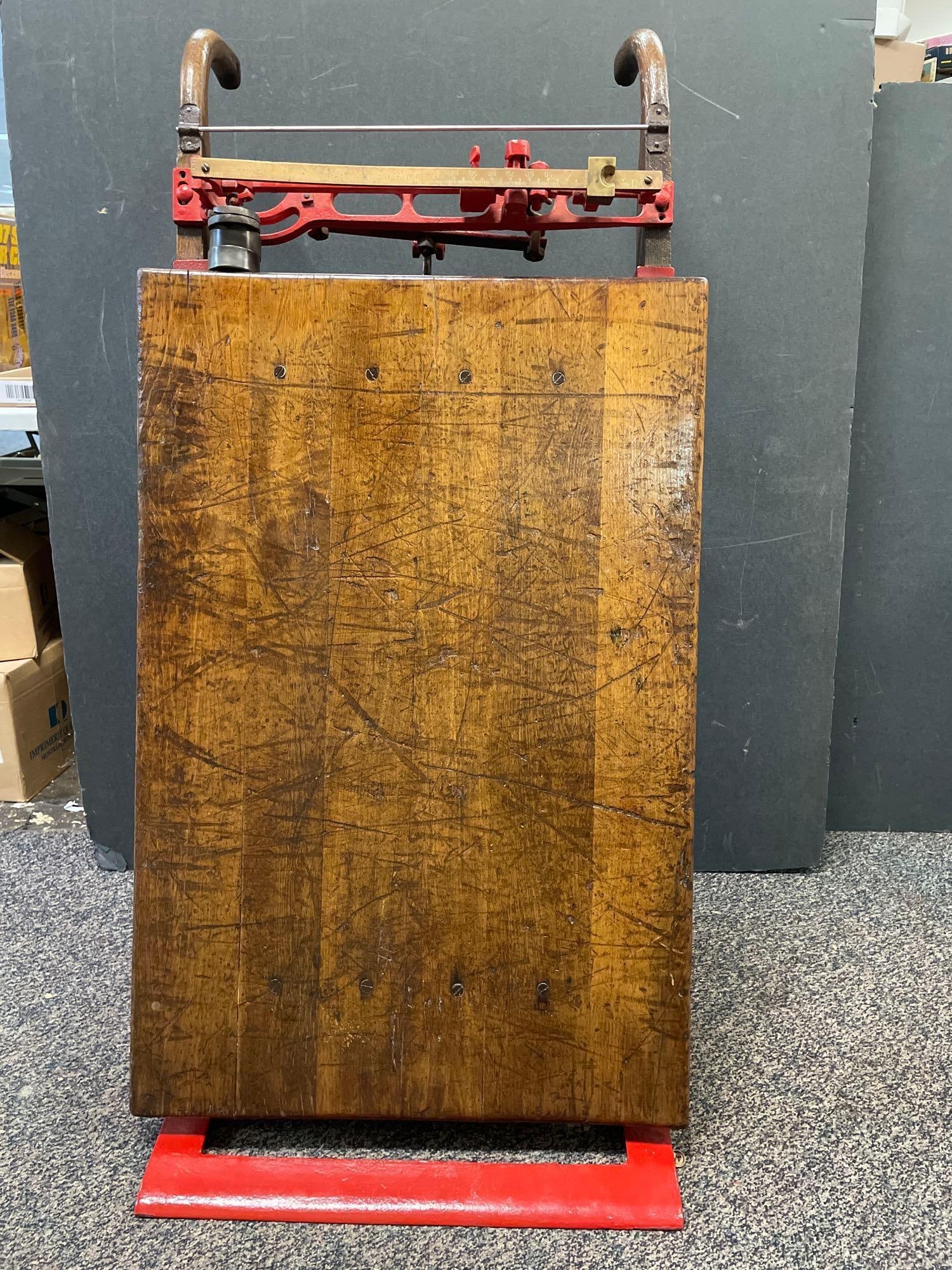 Antique Renfrew Cast Iron and Wood Portable Grain Scale: No in-house shipping available, 3rd party shipper or pickup only. Includes weights, measures 17 1/2 inches x 48 inches x 24 inches