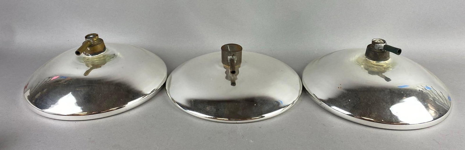 Group of 3 Antique 1930s Mercury Glass Oil Lamp Reflectors: largest measures 10 inches in diameter.