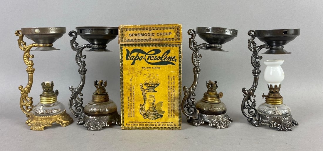 Group of 4 Antique Vapo-Cresolene Vaporizer Lamps: One includes original packaging. Missing Glass Shields. One measures 6 inches in length.