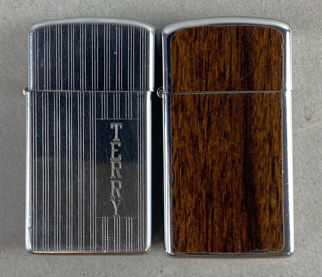 Group of 2 1980s Zippo Slim Petro Flip Lighters: One measures 2 1/2 inches tall.