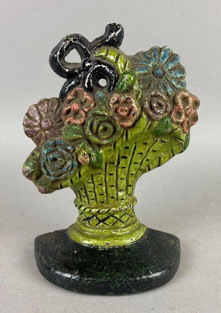 Antique 1930s Hubley Mix Flower ls in French Basket Cast Iron Door Stop: Measures 6 inches tall.