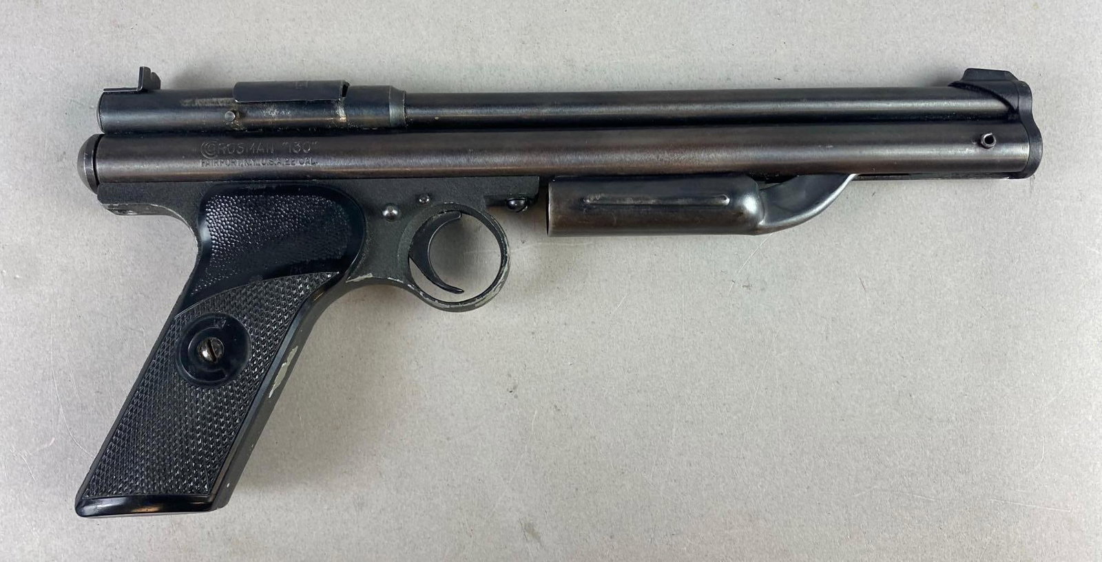Vintage 1960s Crosman Model 130 Pump-Action .22 Cal Air Pistol: non-Working condition. Does not hold air. Might need new seals. Measures 11 1/2 inches in length.