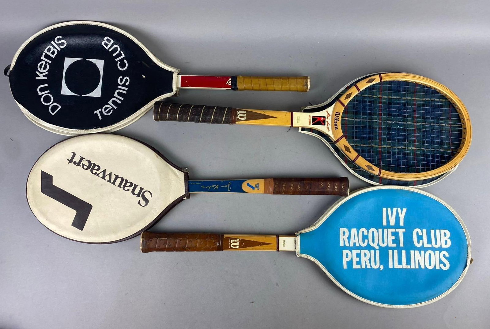 Group 5 Vintage Wilson Tennis Rackets: one measures 26 inches in length.