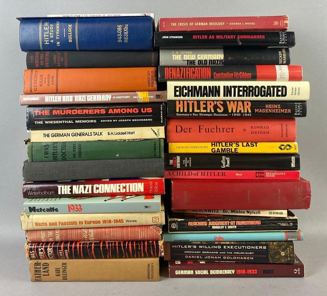 Group of Assorted WW2 Books and More: Includes Auschwitzs, Hitler War, and more. Largest measures L 8 x W 5 1/2 inches. Rips and tears throughout.