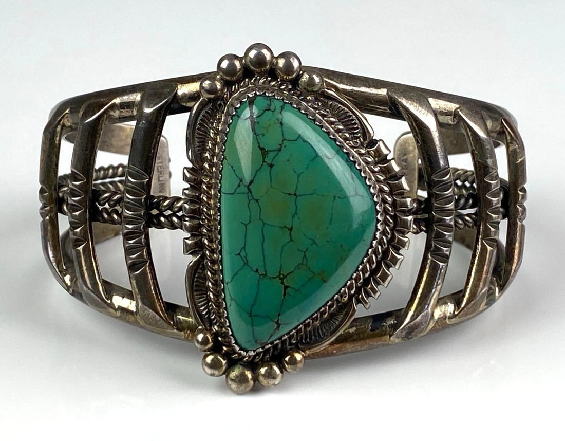 Sterling Silver Turquoise Cuff Bracelet: Total weight of 73.6 grams, Measures 2 inches H, Inner circumference Measures 7 inches with a 1 1/2 inches opening