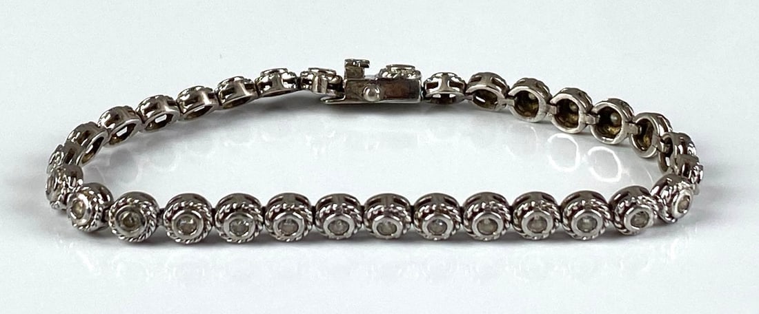 ATI Signed Sterling Silver CZ Tennis Bracelet: Clasp loose, measures 7 inches in length