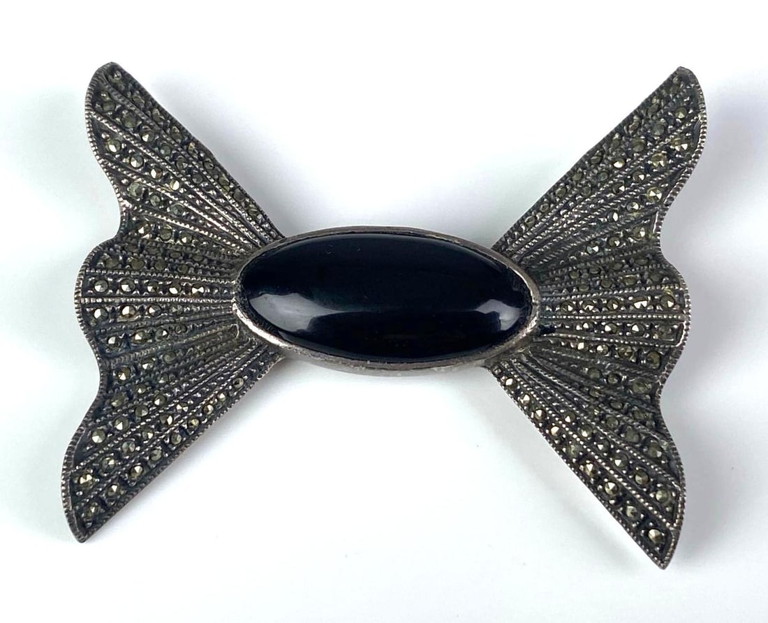 Sterling Silver Marcasite Onyx Bowtie Brooch: Missing pin, Measures 2 inches H x 2 1/4 inches W