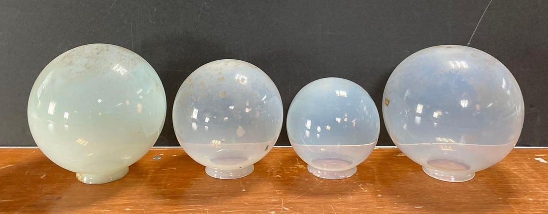 Group of 4 Antique Vaseline Glass Globe Lamp Shades: 3 1/4 inches fitters, largest measures 8 inches