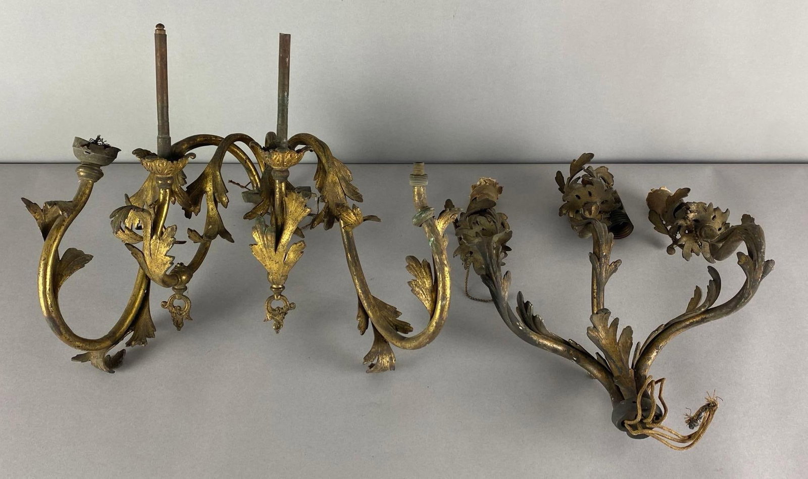 Group of 2 Antique Art Nouveau Wall Sconces: Untested, Includes electric/has 4 light wall sconce and 3 light electric wall sconce, paint wear and damage throughout, largest measures 13 inches H x 14 inches W x 12 inches D