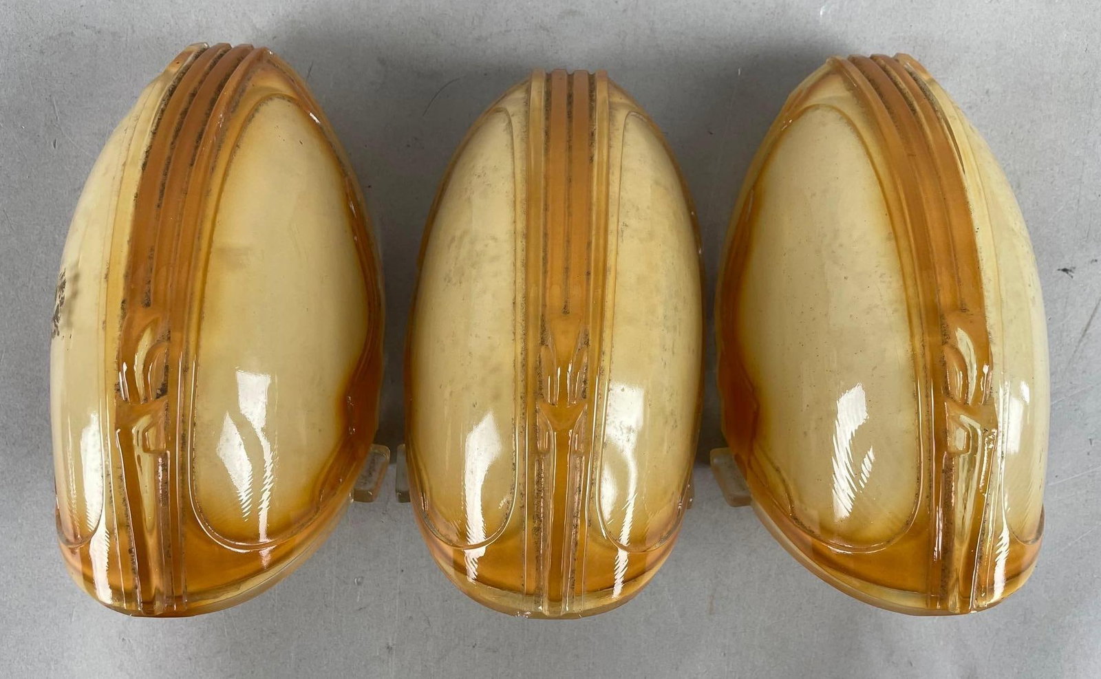 Group of 3 Art Deco Amber Glass Slip Shades: Each measure 7 1/4 inches x 4 1/4 inches x 4 1/2 inches