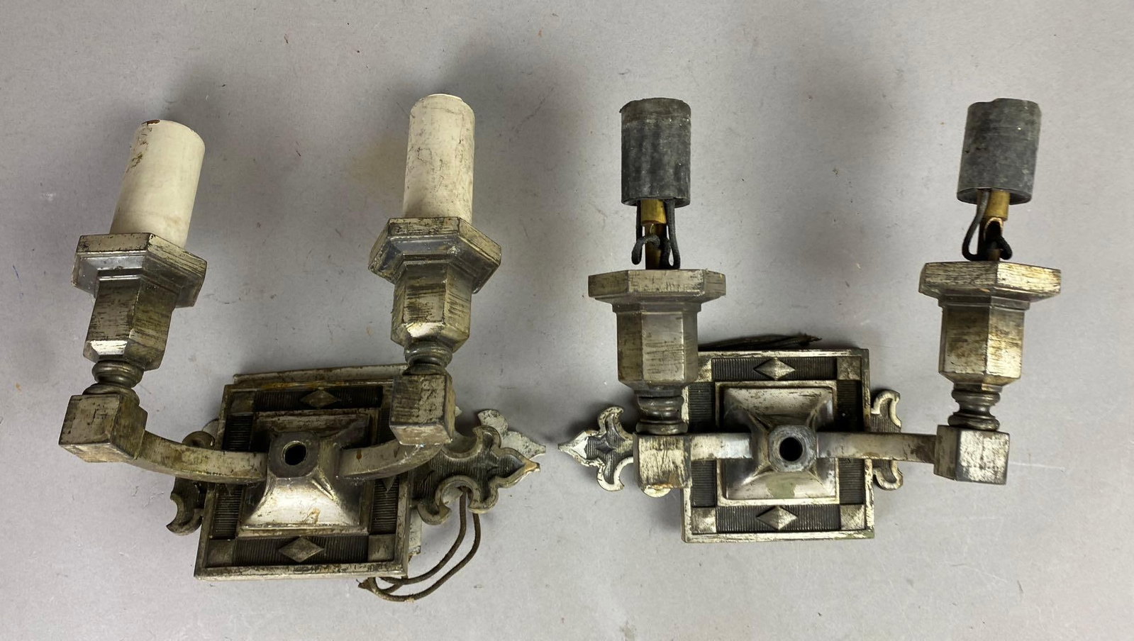 Group of 2 Antique 1930s Gothic Electric Candle Light Sconces: Will need rewiring. One measures 9 inches tall. Comes with hardware.