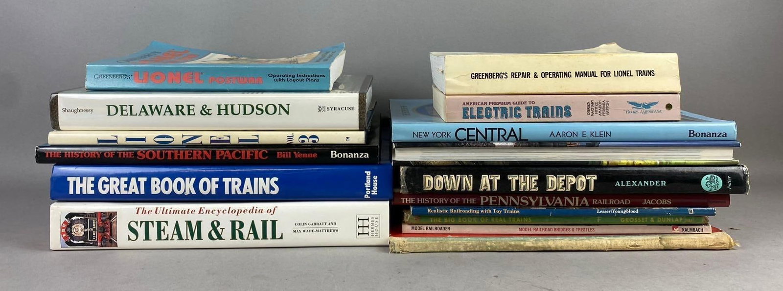 Group of Assorted Train Themed Books: Rips and tears throughout. Largest Measures L 11 x W 9 inches.